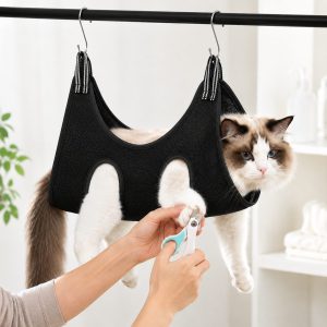 Black pet grooming sling bag for cats and small dogs during supervised grooming