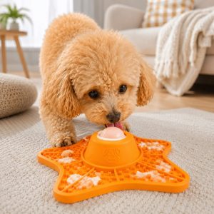 Orange rolling ball slow feeder lick mat for dogs and cats.